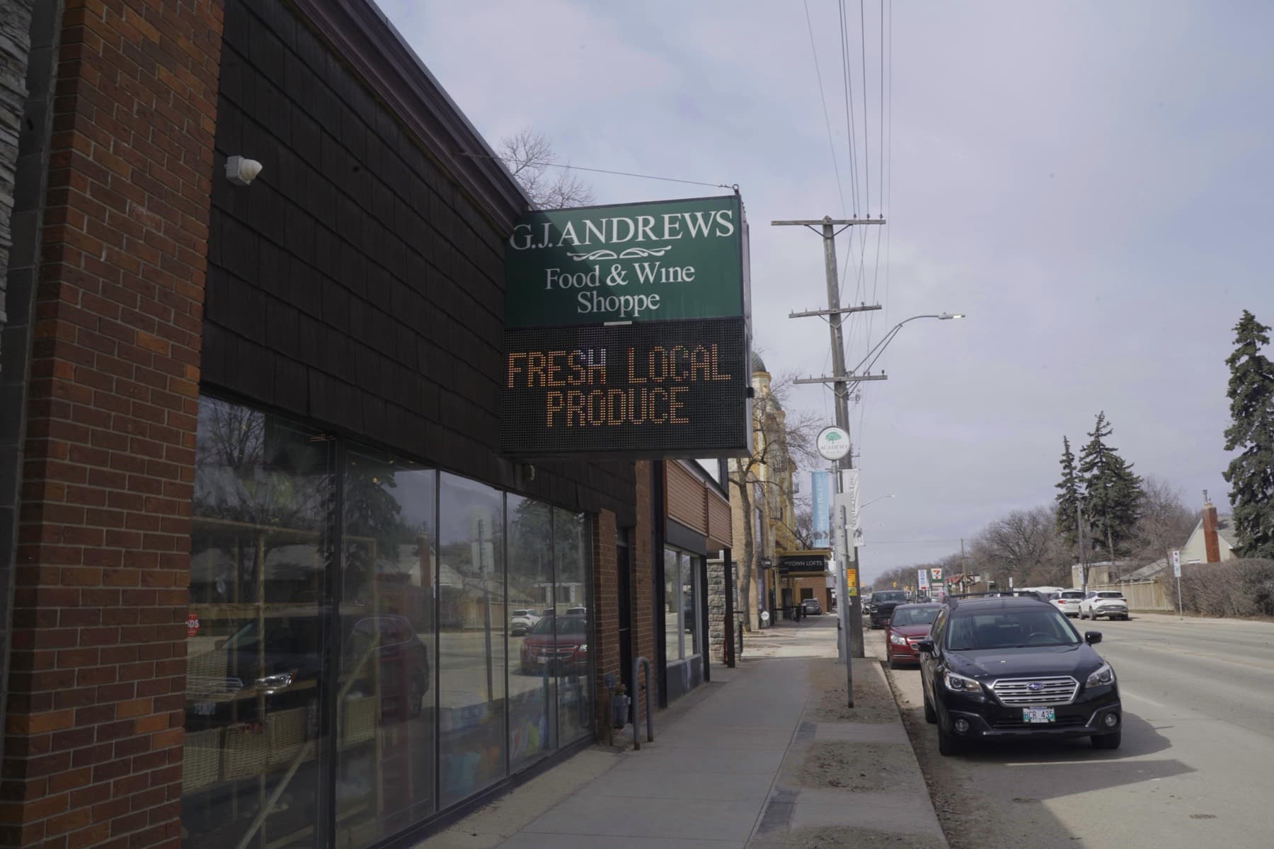 The G.J. Andrews Food & Wine Shoppe sign above the shopfront on Academy Road.